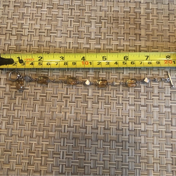 Simply Stunning  amber coloured bracelet with silver bead accents in between - Picture 11 of 13